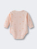 Pale pink baby bodysuit with small apple print pattern laid flat Long Sleeve Bodysuit - Apples Baby girl