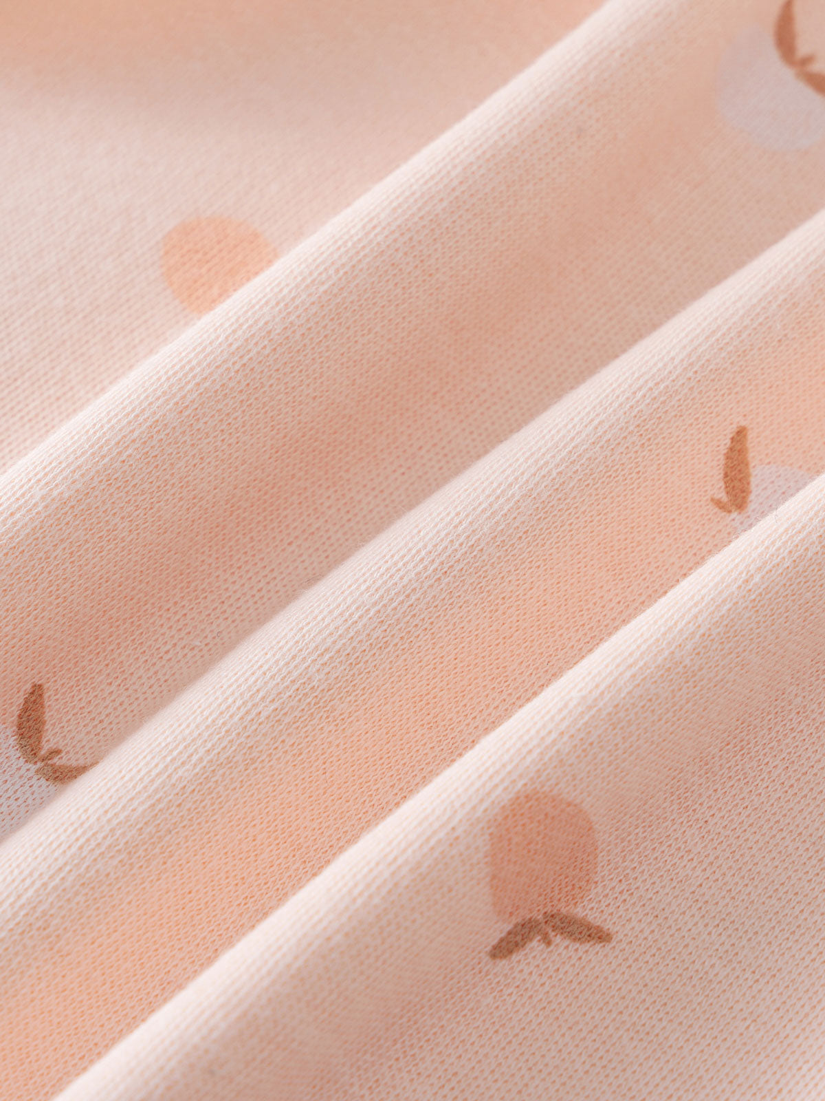 Close-up of light pink ribbed fabric with small apple print pattern Long Sleeve Bodysuit - Apples Baby girl
