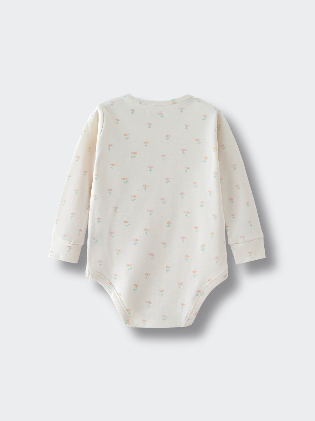Cream-colored baby bodysuit with small floral print pattern laid flat Long Sleeve Bodysuit - Spring Bloom Baby girl