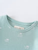 Close-up of a light blue bodysuit neckline with small white printed patterns Matt Short Sleeve Bodysuit - Summer Time Baby boy