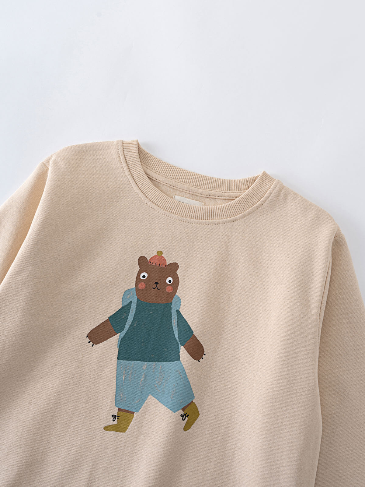 Beige sweatshirt with cartoon bear wearing blue clothing and boots Feature Print Sweatshirt - Hiking Bear Baby boy