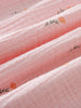 Close-up of pink fabric with floral embroidery Muslin Dress - Poppy Field Girls