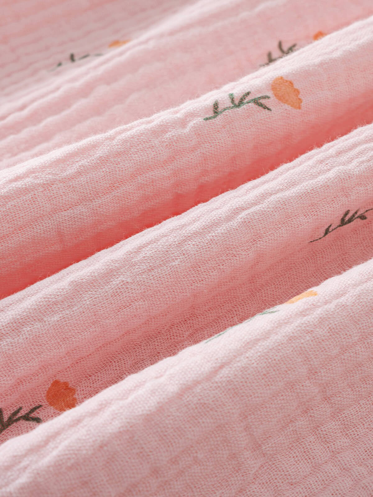 Close-up of pink fabric with floral embroidery Muslin Dress - Poppy Field Girls