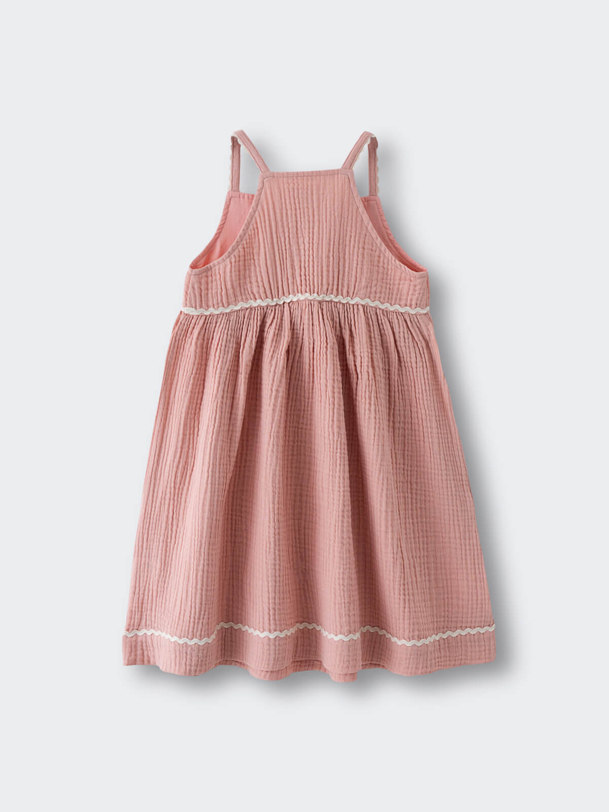 Pink textured dress with shoulder straps and white trim detail at hem muslin Dress - Toasted Peach Girls
