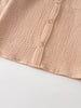 Close-up of a beige textured shirt with buttons and pocket detail Muslin Long Sleeve Shirt - Sand Boys