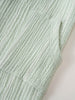 Close-up of light green striped fabric romper showing pocket detail Muslin Romper - Light Green Stripe Baby boy