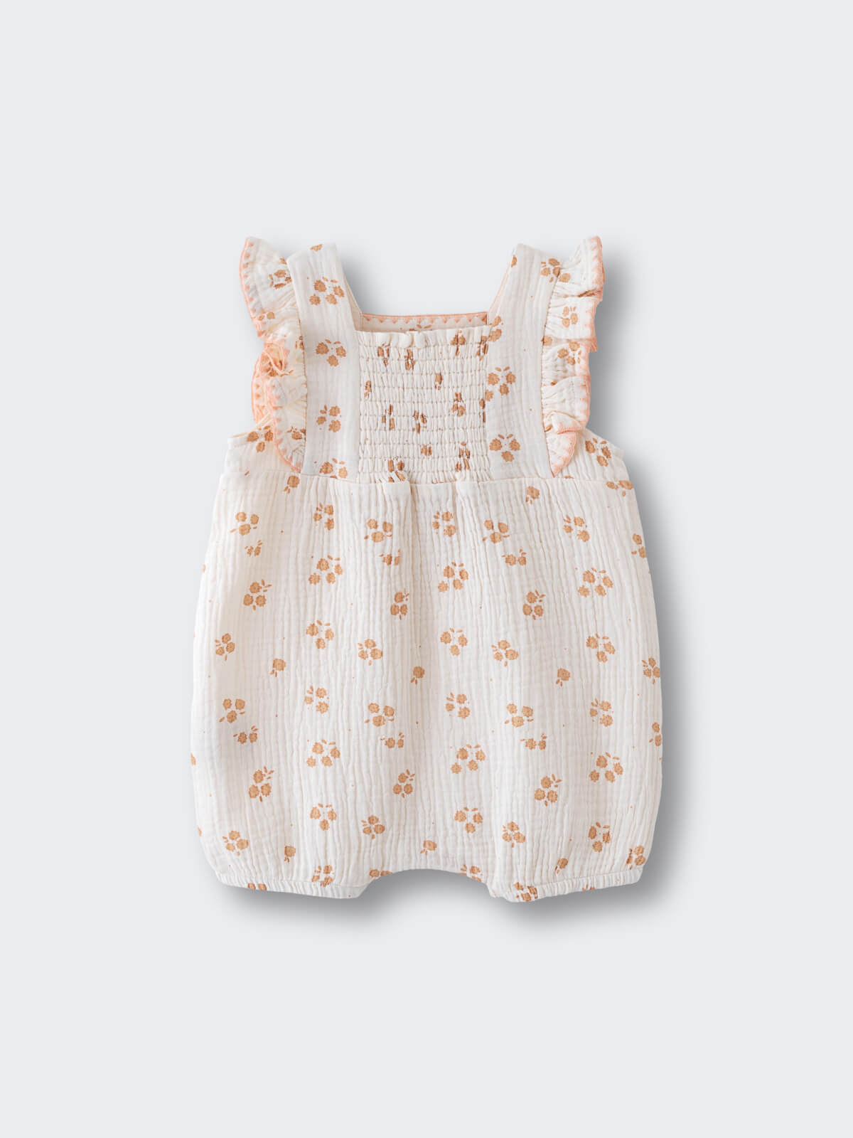 White baby romper with orange floral print and ruffle straps muslin Romper - Petal Paws Baby girl