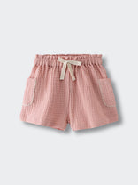 Pink textured shorts with drawstring waist and patch pockets on white background Muslin Shorts - Toasted Peach Girls