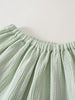 Close-up of light green striped gathered skirt waistband with elastic Muslin Skirt - Light Green Stripe Girls