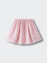 Pink embroidered skirt with floral pattern and elastic waistband laid flat Muslin Skirt - Poppy Field Girls