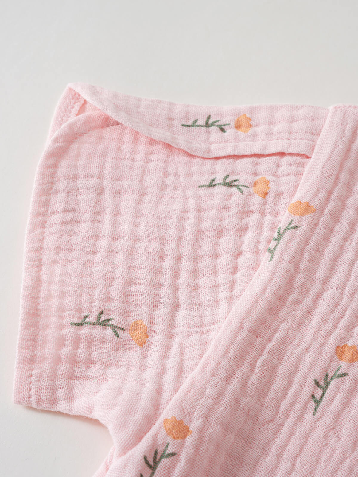 Pink textured fabric with small embroidered orange flower and green stem pattern Muslin Top - Poppy Field Girls