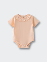 Peach colored short sleeve bodysuit with ruffled collar detail on light background Olivia Short Sleeve Bodysuit - Apricot Baby girl