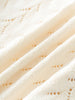 Close-up of a textured cream-colored cable knit cardigan fabric surface Pointelle Cardigan - Ecru Girls