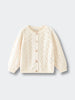 Cream-colored cable knit cardigan on a light gray background Pointelle Cardigan - Ecru Girls