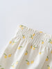 Close-up of white fabric waistband with yellow lemon and green leaf pattern Printed Bloomers - Lemons Baby girl