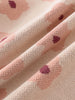 Close-up of fabric with floral pattern on a beige background Printed Cardigan - Bold Daisy Girls