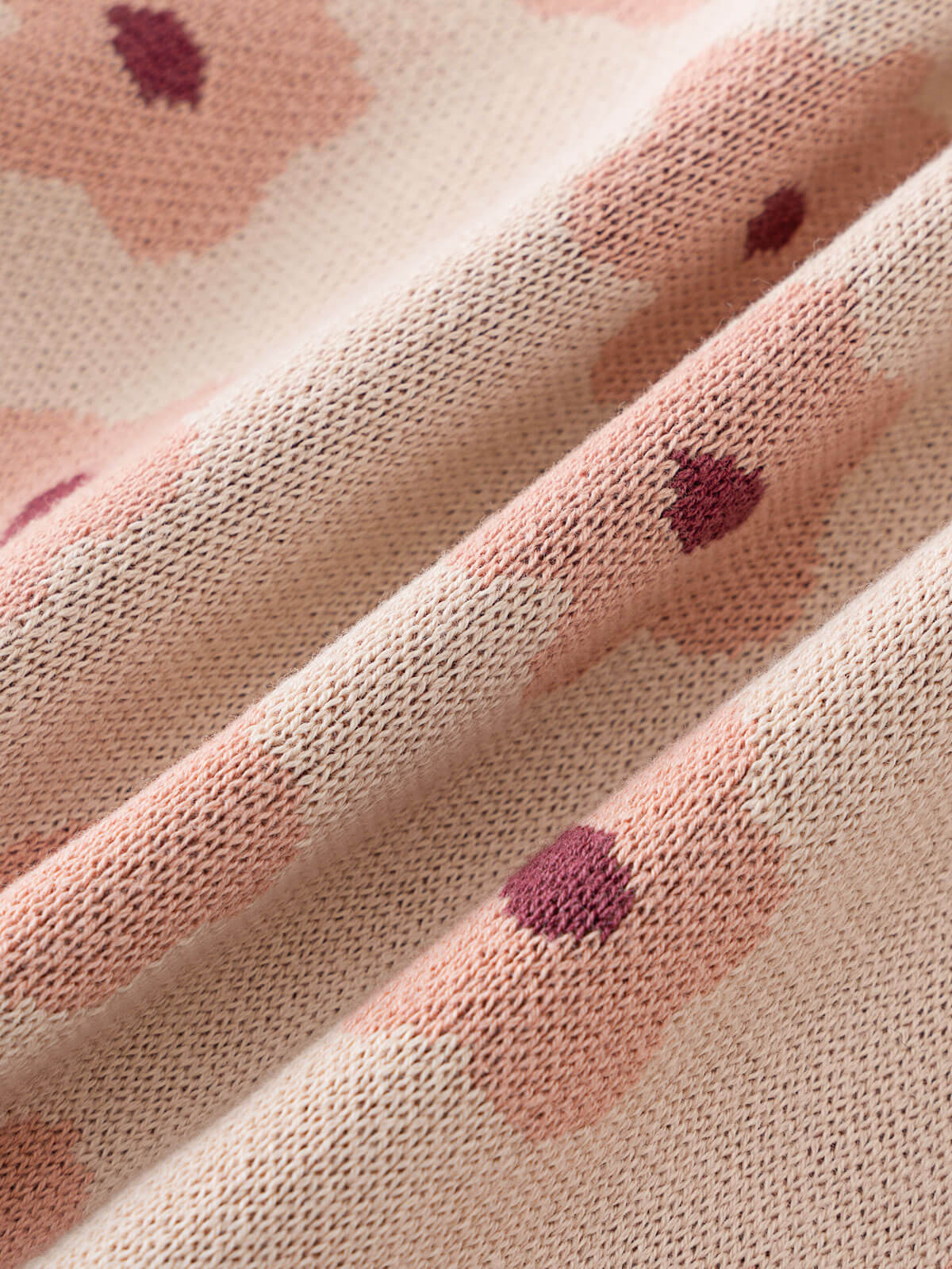 Close-up of fabric with floral pattern on a beige background Printed Cardigan - Bold Daisy Girls