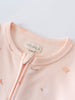Close-up of a pale peach baby garment with zipper and size label Printed Long Sleeve One Piece - Apples Baby girl