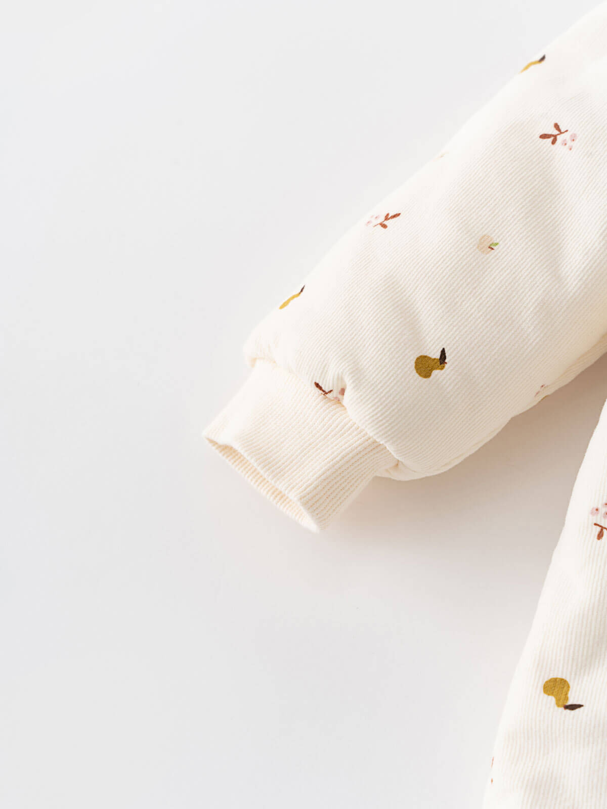 Cream hooded baby pram suit with fruit pattern on a light gray  Printed Pram Suit - Autumn Harvest Ecru Baby girl