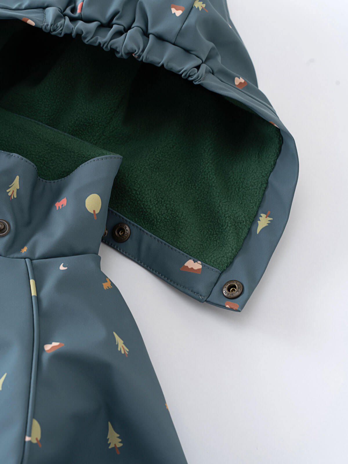 Blue baby rain suit with colorful patterns on a light gray background Printed Puddle Suit - Mountain View Balsam Baby girl