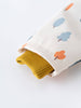 Yellow knitted sweater partially inside a white bag with tree pattern Printed Raincoat - Forest Adventure Ecru Boys