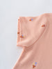 Close-up of peach fabric with small ice cream cone print details Printed Short Sleeve Tee Shirt - Ice Creams Girls