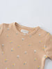 Close-up of a beige bodysuit with small floral pattern print Printed Short Sleeve Bodysuit - Floral Bloom Baby girl