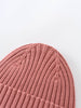 Close-up of a pink knitted beanie on a light gray background Ribbed Beanie - Rosehip Girls