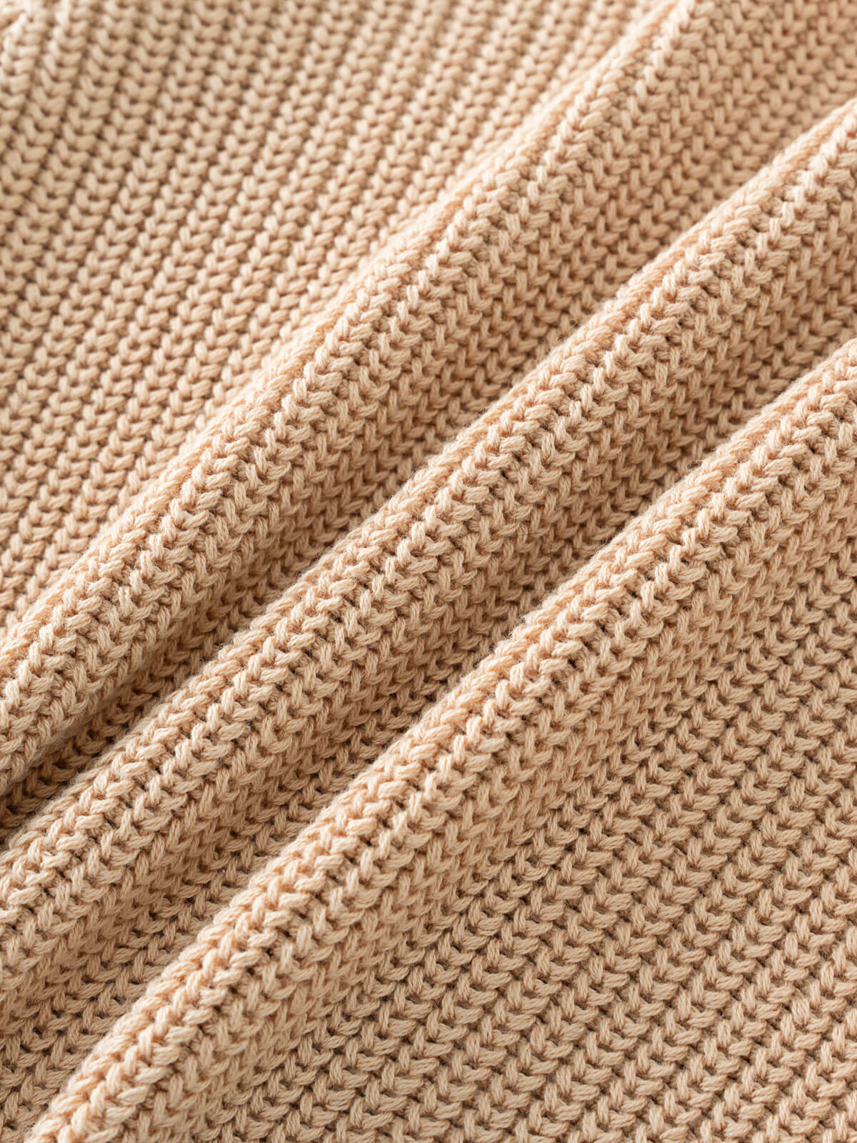 Close-up of beige knitted fabric
