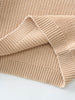 Close-up of beige knitted fabric on a light background