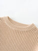 Close-up of a beige knitted sweater on a white background