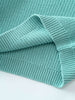 Lake blue sweater on a light blue background
