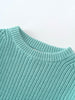 Lake blue sweater on a light blue background