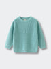 Lake blue sweater on a light blue background