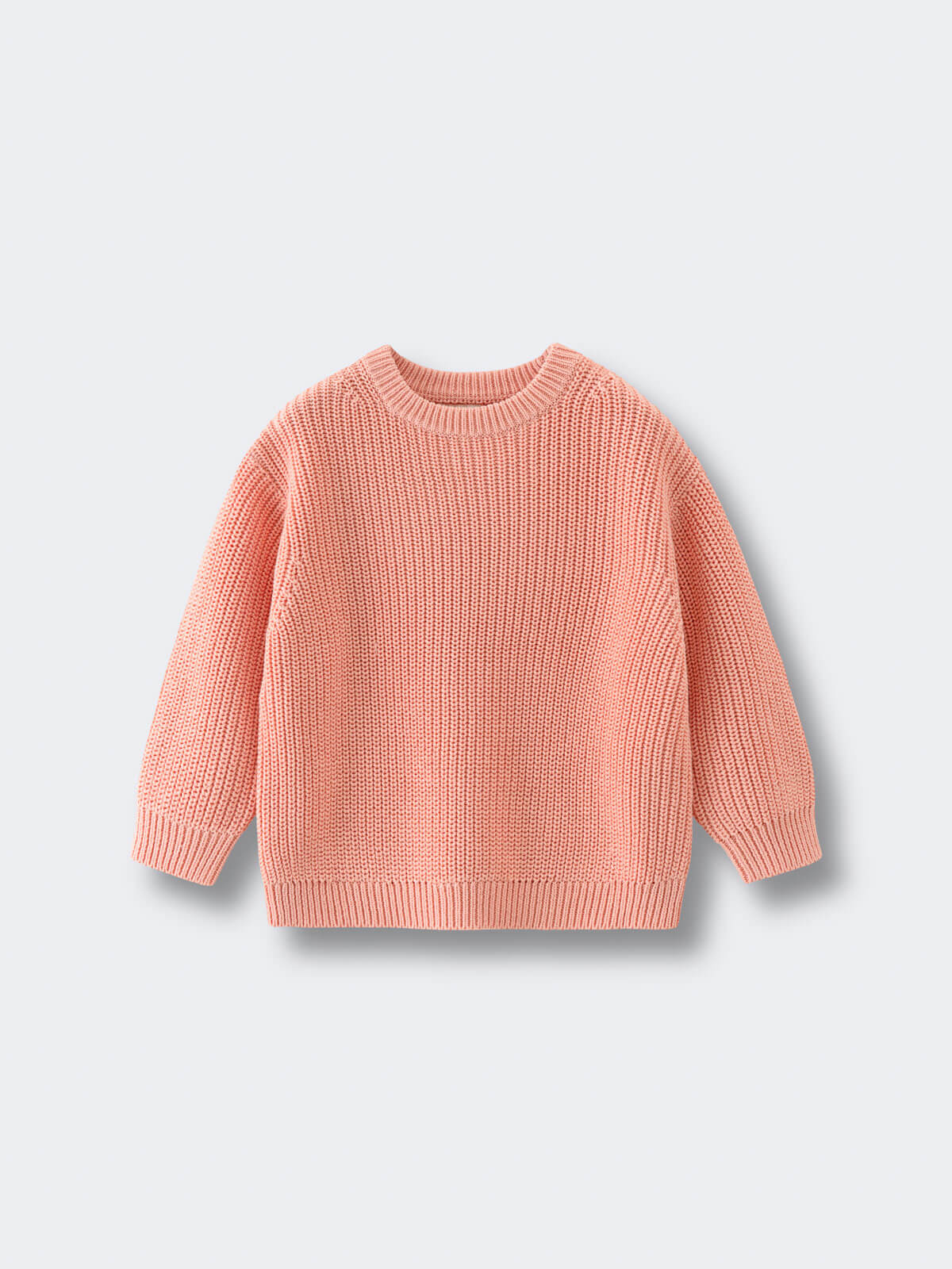 Pink sweater on a light gray background