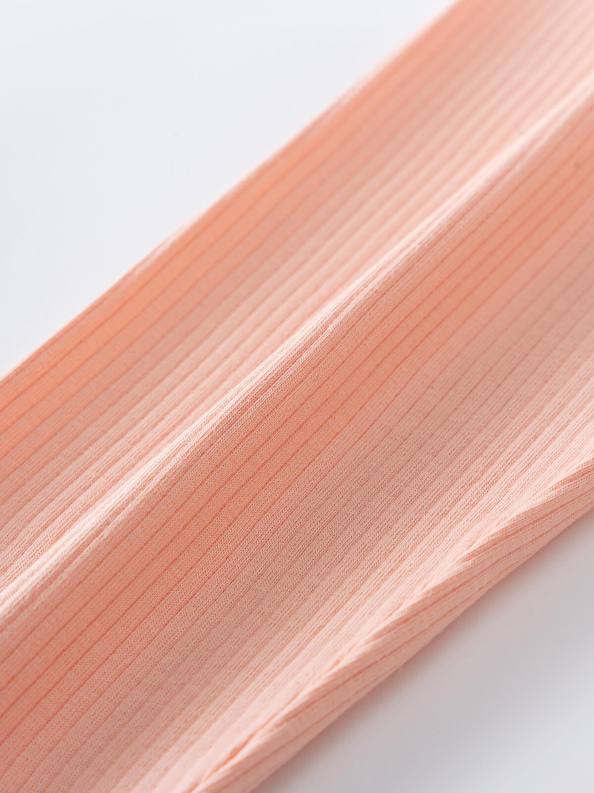 Close-up of peachy pink ribbed fabric texture with fine lines Ribbed Leggings - Toasted Peach Girls