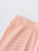 Close-up of peach ribbed fabric with elastic waistband on gray background Ribbed Leggings - Toasted Peach Girls