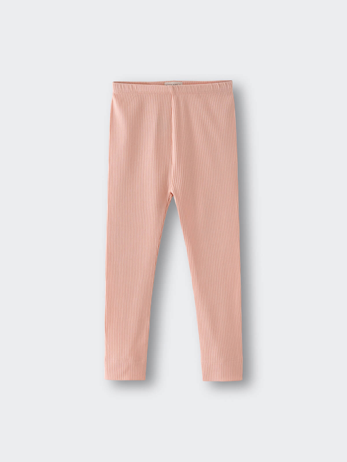 Ribbed peach-colored leggings laid flat on a light gray background ribbed Leggings - Toasted Peach Girls