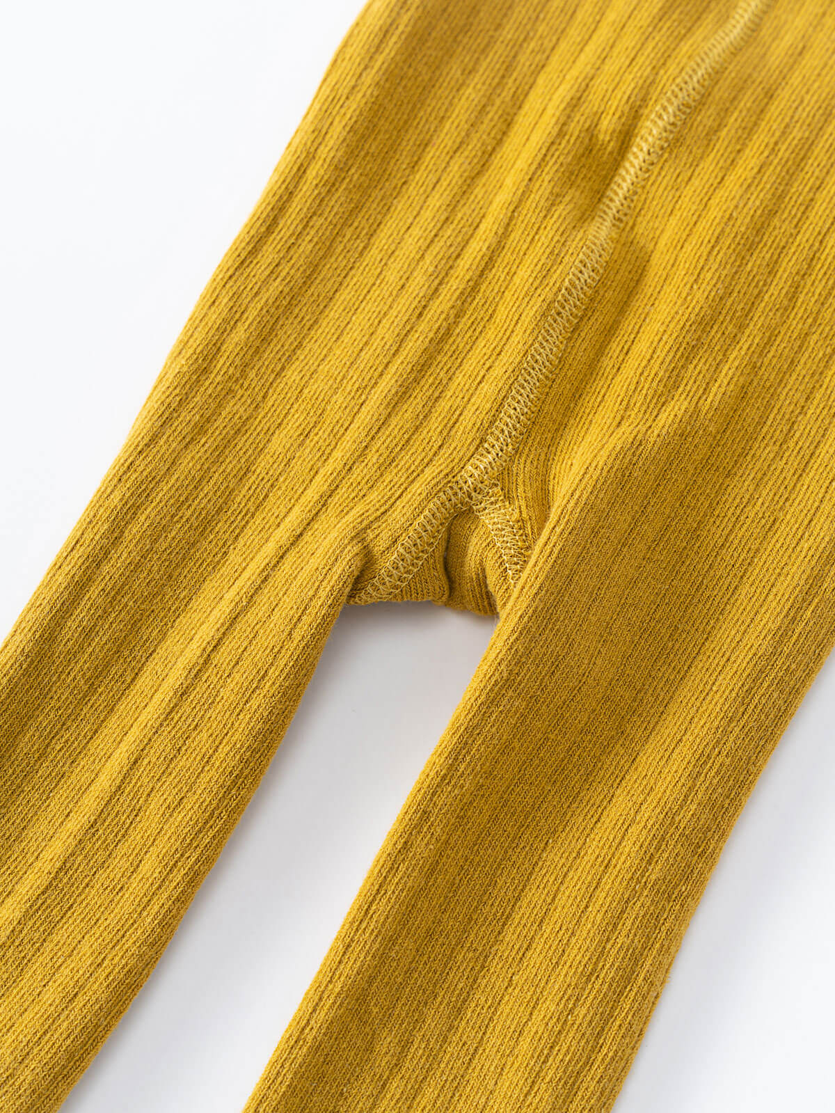 Close-up of mustard yellow ribbed fabric tights showing texture and seam detail Ribbed Tights 2 Pack - Golden Pear/Ecru Girls