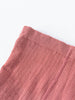 Close-up of pink ribbed knit fabric with diagonal texture and finished edge Ribbed Tights 2 Pack - Rosehip/Russet Girls