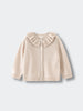 Beige cardigan with ruffled collar on a light gray background Ruffle Cardigan - Ecru Girls