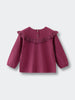Purple blouse with ruffled collar on a light gray background Ruffle Top - Plum Jam Girls