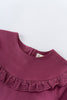 Close-up of a maroon blouse with lace trim on a white background Ruffle Top - Plum Jam Girls