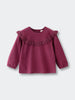 Purple blouse with ruffled collar on a light gray background Ruffle Top - Plum Jam Girls