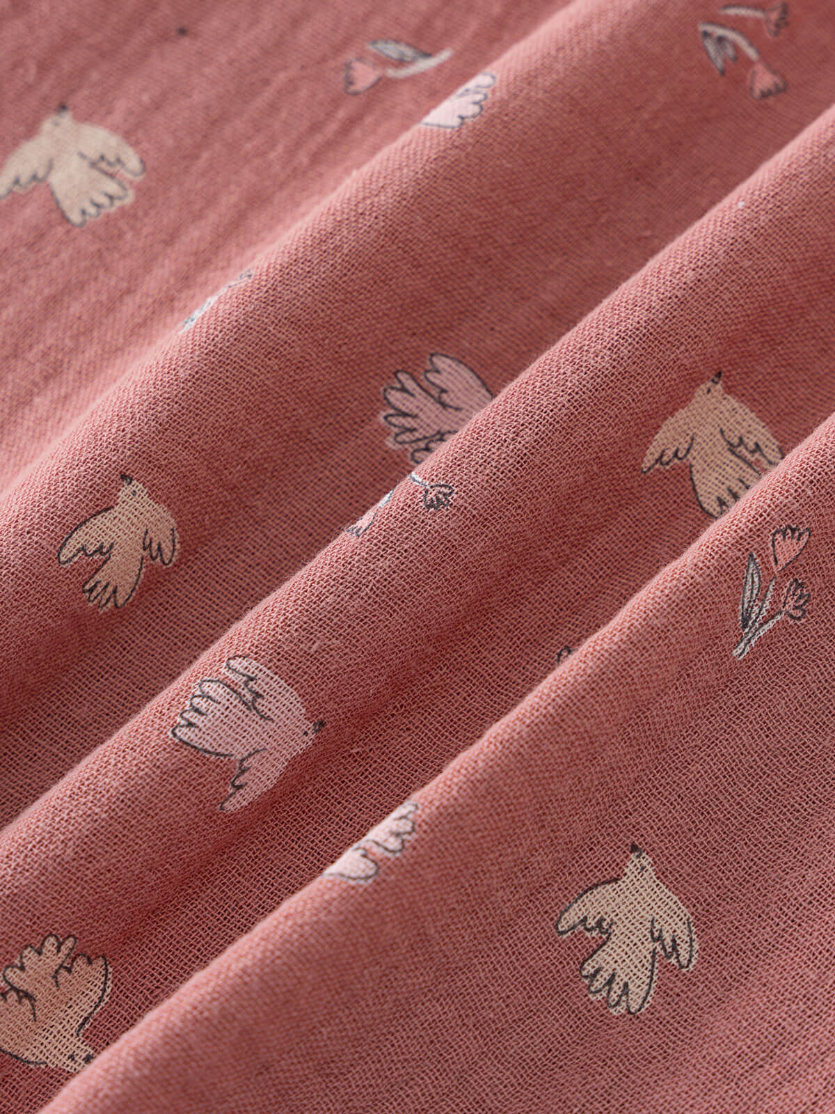 Close-up of pink fabric with small white animal prints Ruffle Woven Blouse - Bird And Blossom Rosehip Girls