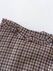 Close-up of a checkered fabric with ruffled trim on a white background Ruffle Woven Blouse - Muslin Cotton Check Girls