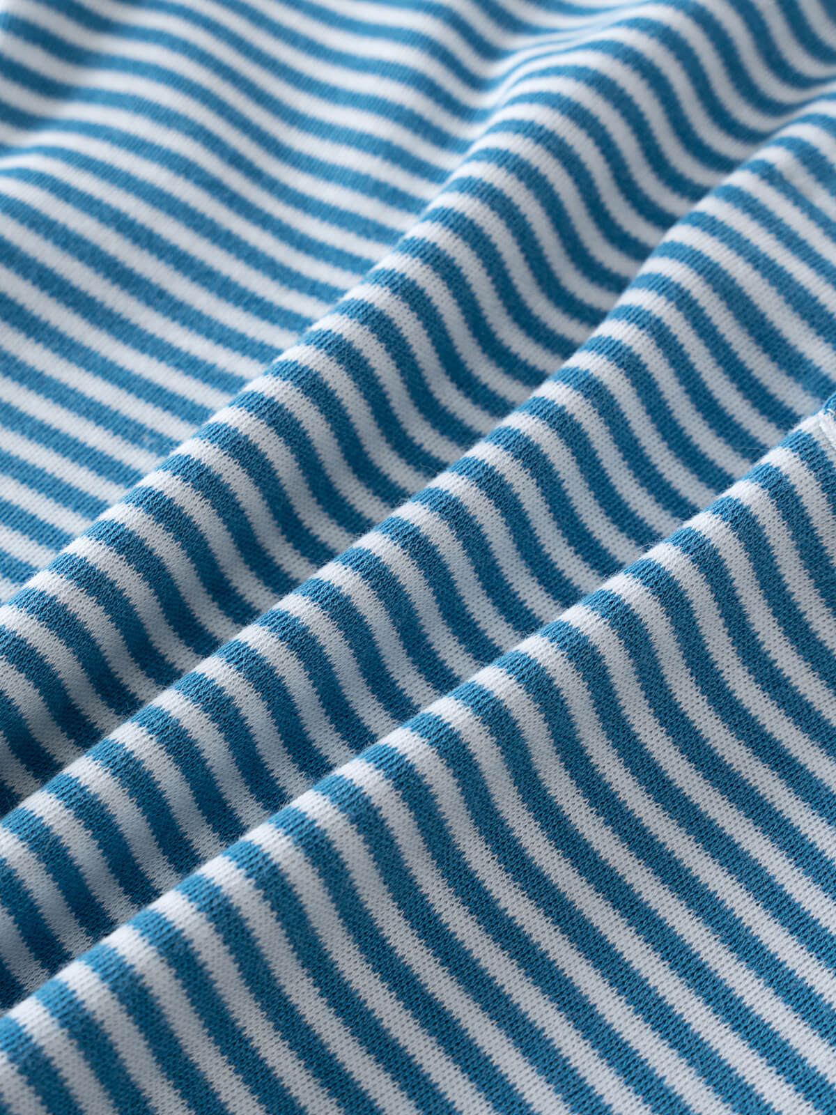Close-up of blue and white striped fabric with visible texture and folds Tee - Blue Stripe Boys