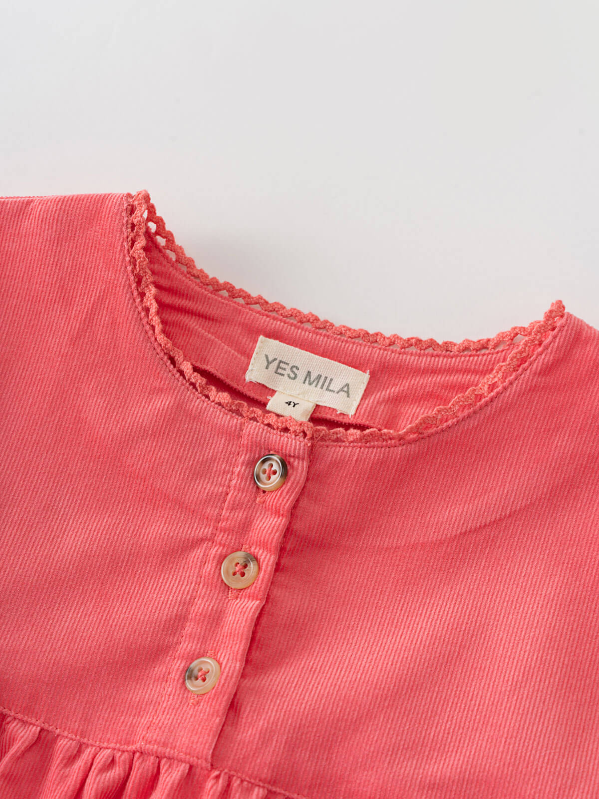 Close-up of pink blouse with long sleeves with lace trim and button details, featuring the brand 'YES MILA'. Three Button Blouse - Cloudberry Girls