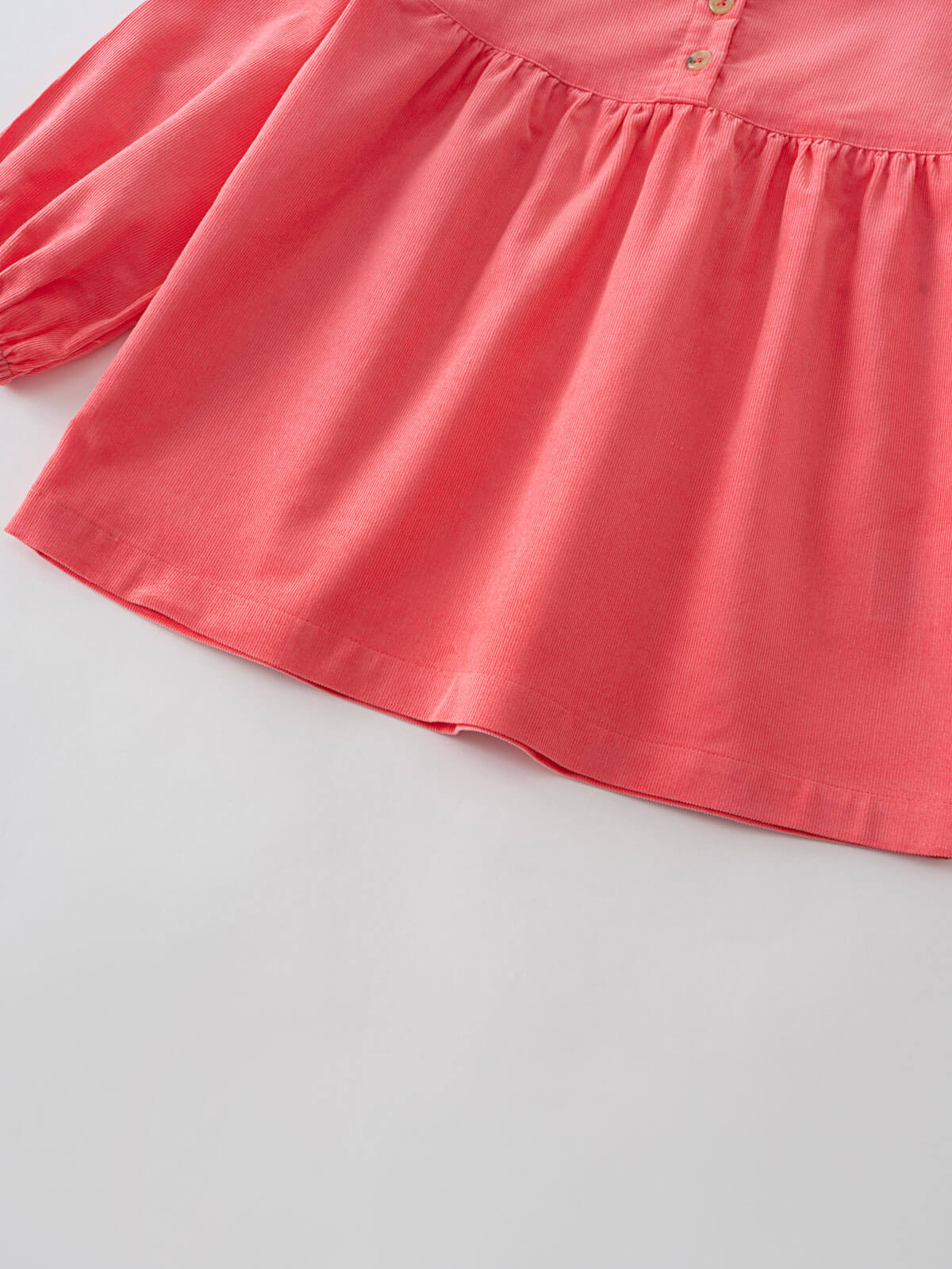 Close-up of a pink blouse with long sleeves on a light gray background Three Button Blouse - Cloudberry Girls
