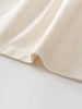 Close-up of a beige fabric on a light gray background Three Button Blouse - Ecru Girls